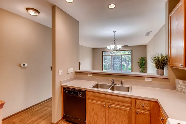 a kitchen with a sink and a window