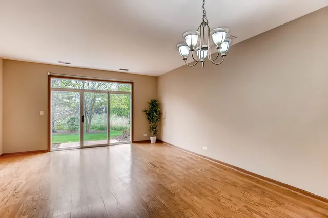 a view of an empty room with a large window