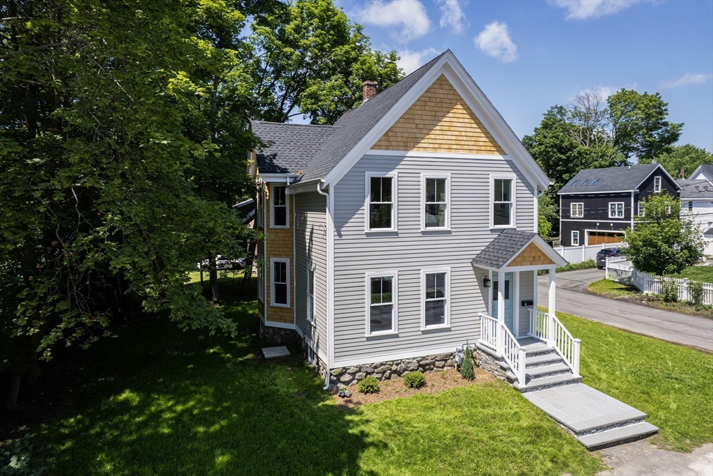 8 Florence Street Natick, MA 01760 - Photo 11 of 38 a front view of house with yard and green space