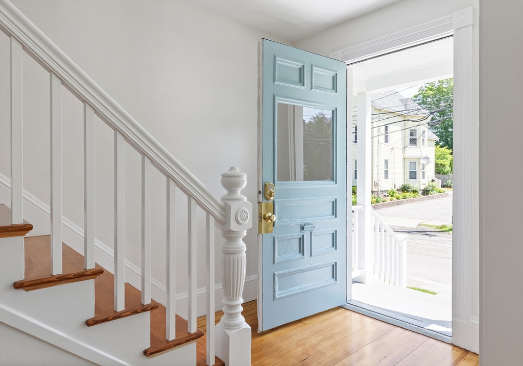 8 Florence Street Natick, MA 01760 - Photo 13 of 38 a view of entryway with wooden floor and door