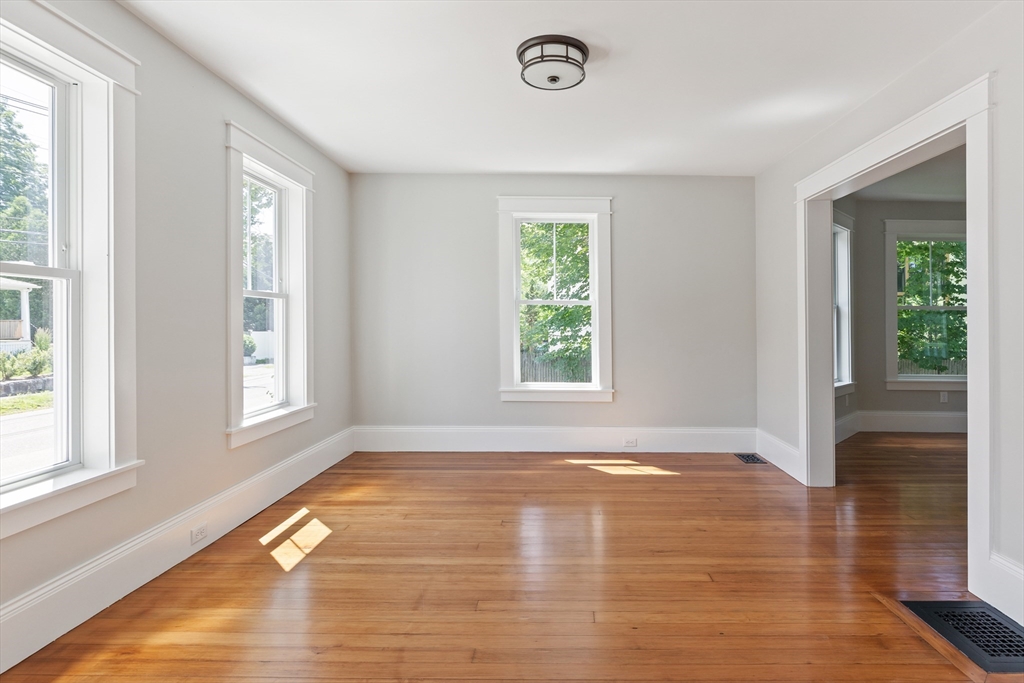 8 Florence Street Natick, MA 01760 - Photo 17 of 38 a view of an empty room with wooden floor and a window