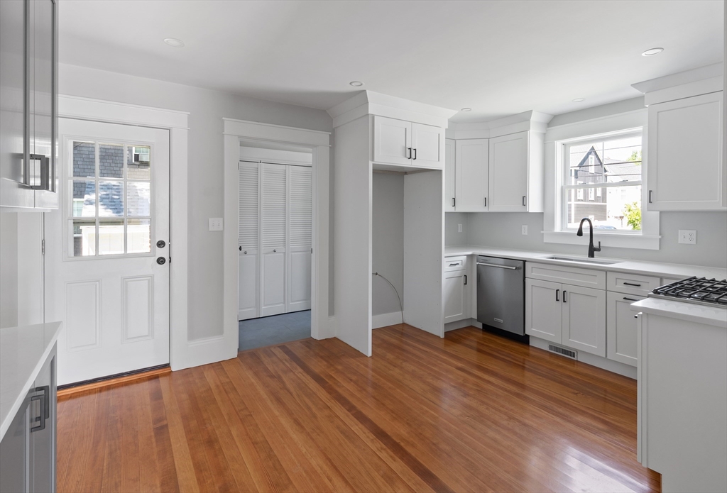8 Florence Street Natick, MA 01760 - Photo 25 of 38 a kitchen with stainless steel appliances a white cabinets and sink