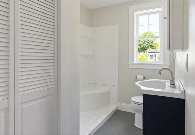 a bathroom with a sink toilet and a bathtub