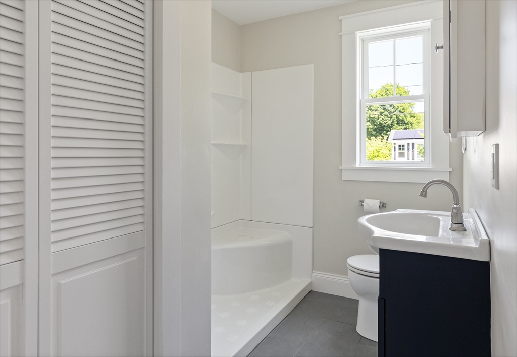 8 Florence Street Natick, MA 01760 - Photo 26 of 38 a bathroom with a sink toilet and tub