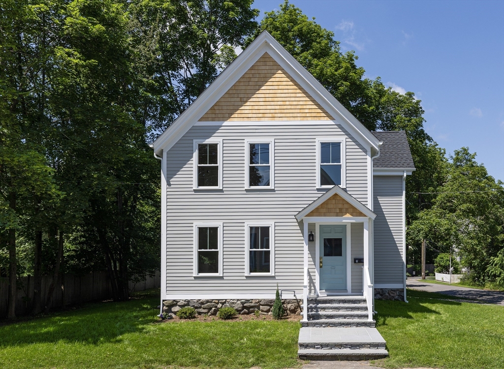 8 Florence Street Natick, MA 01760 - Photo 3 of 38 a front view of a house with a yard