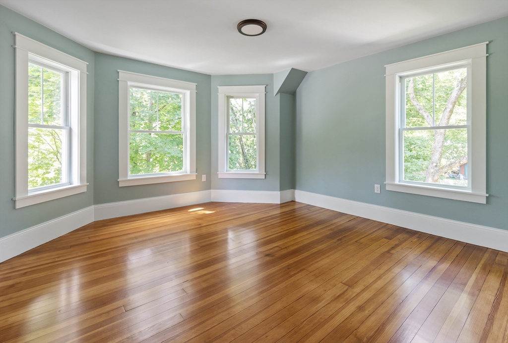 8 Florence Street Natick, MA 01760 - Photo 32 of 38 a view of an empty room with wooden floor and a window