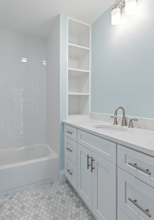 8 Florence Street Natick, MA 01760 - Photo 37 of 38 a bathroom with a sink a toilet and bathtub