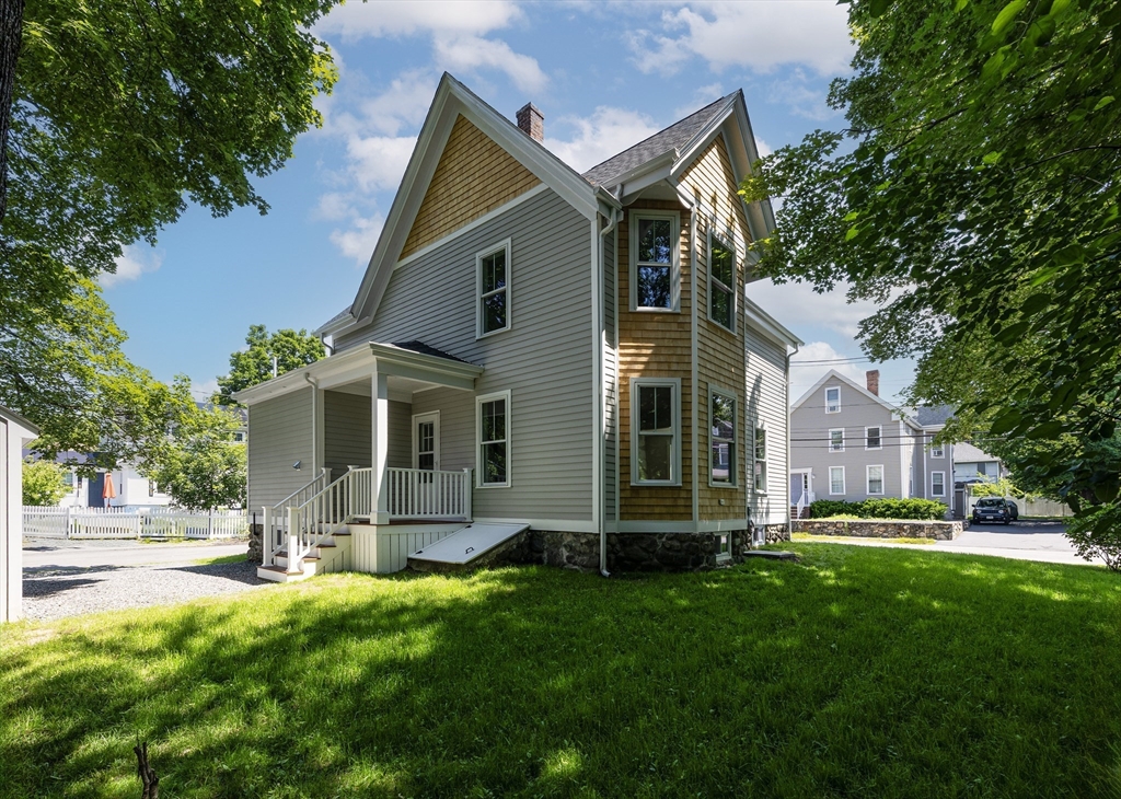 8 Florence Street Natick, MA 01760 - Photo 8 of 38 a front view of house with yard and green space