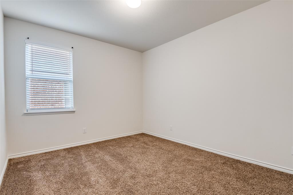 905 Philadelphia Street Fate, TX 75189 - Photo 13 of 25 an empty room with a window