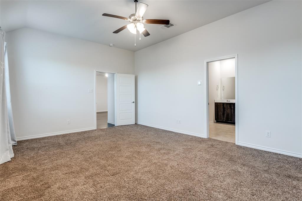 905 Philadelphia Street Fate, TX 75189 - Photo 19 of 25 an empty room with a ceiling fan and a window