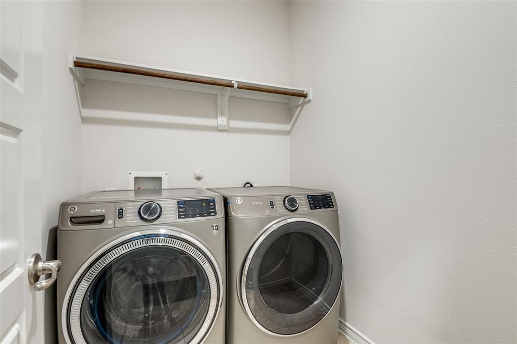 905 Philadelphia Street Fate, TX 75189 - Photo 23 of 25 a utility room with dryer and washer
