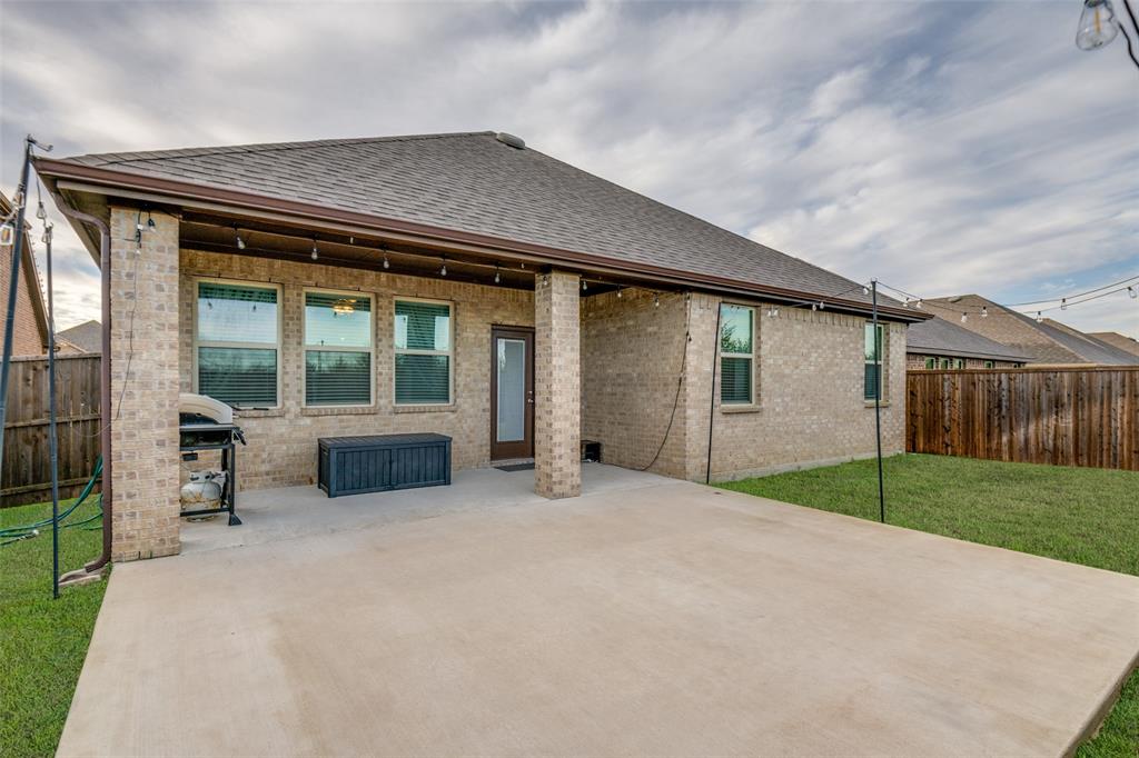 905 Philadelphia Street Fate, TX 75189 - Photo 25 of 25 a view of an house with backyard and porch
