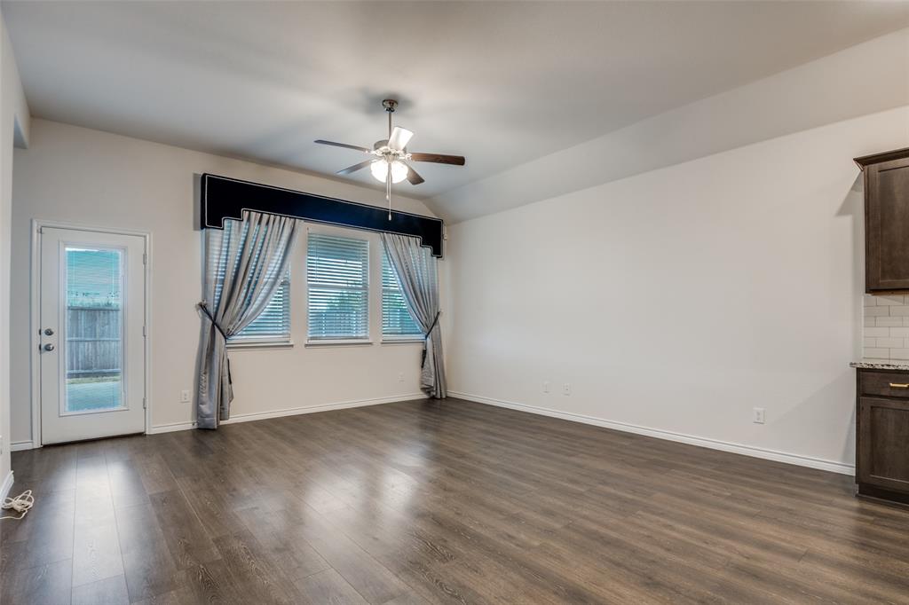 905 Philadelphia Street Fate, TX 75189 - Photo 6 of 25 wooden floor in an empty room with a window