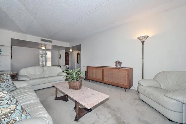 a living room with furniture and a couch