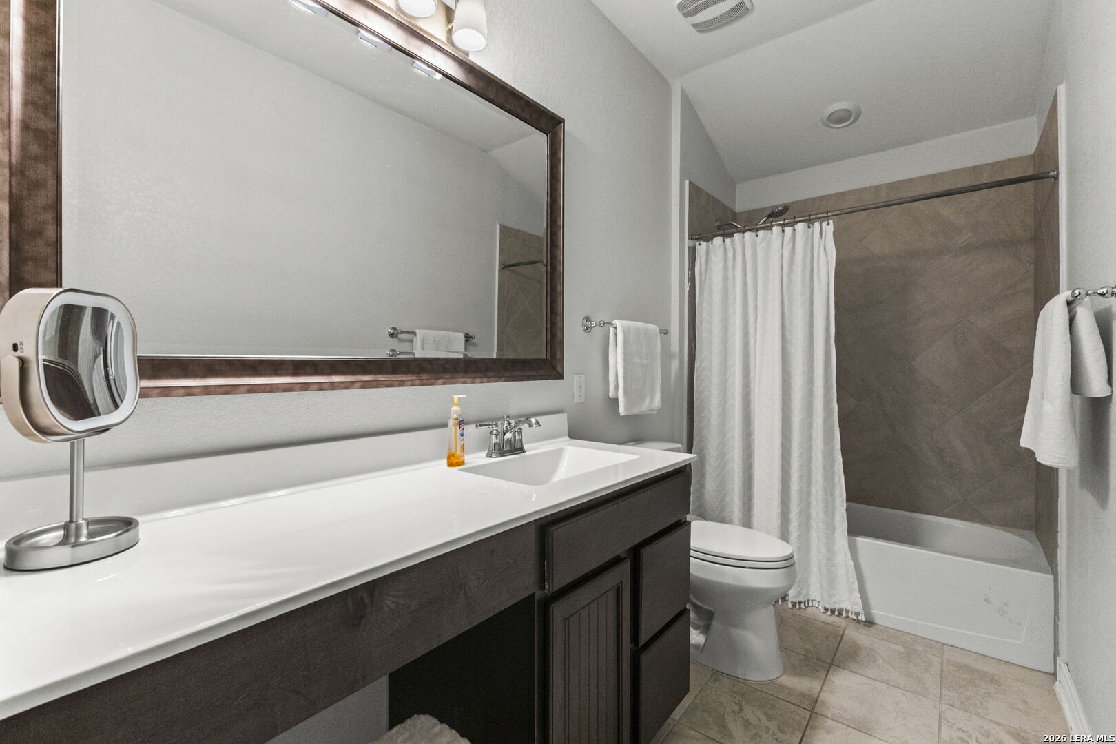29985 Sebastian Bulverde, TX 78163 - Photo 29 of 37 a bathroom with a sink a toilet a mirror and bathtub