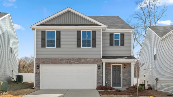 a front view of a house with yard