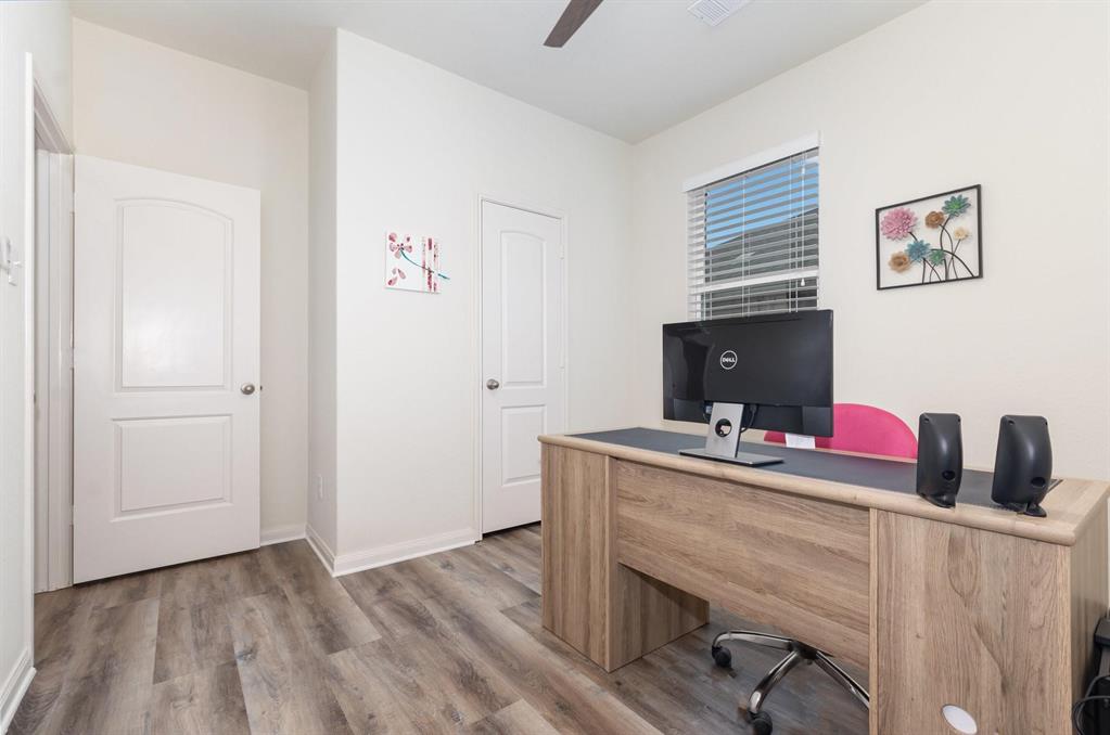 1906 Pilot Point Way Princeton, TX 75407 - Photo 12 of 14 a view of a workspace with furniture and wooden floor