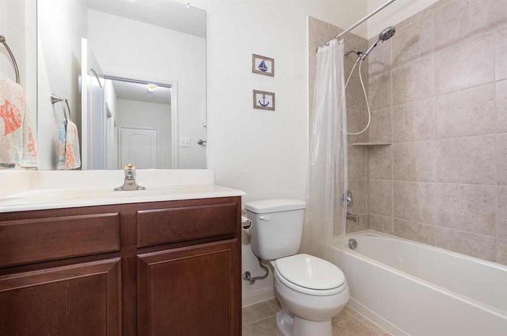 1906 Pilot Point Way Princeton, TX 75407 - Photo 13 of 14 a bathroom with a sink toilet and shower