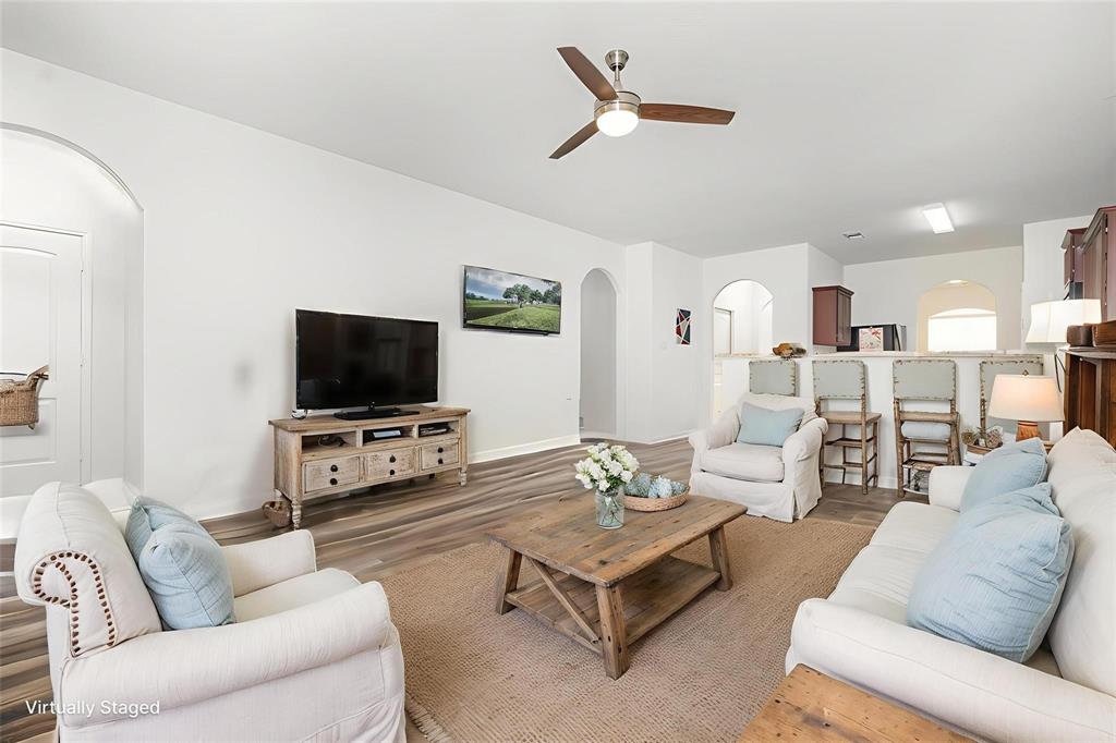 1906 Pilot Point Way Princeton, TX 75407 - Photo 3 of 14 a living room with furniture and a flat screen tv