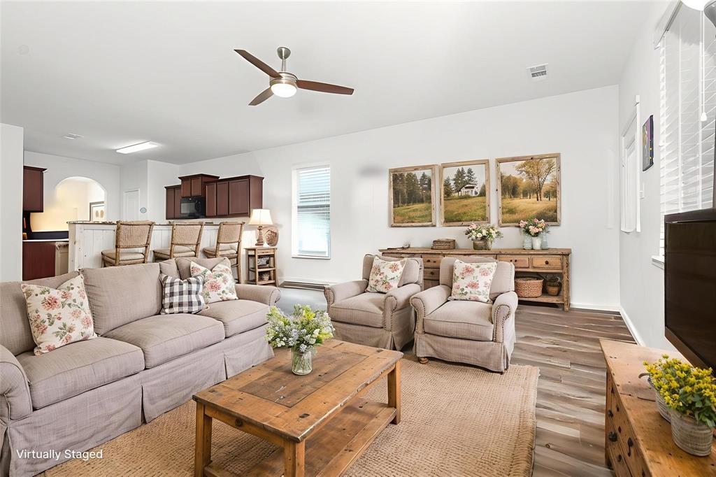 1906 Pilot Point Way Princeton, TX 75407 - Photo 4 of 14 a living room with furniture flat screen tv and a fireplace