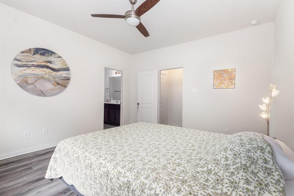 1906 Pilot Point Way Princeton, TX 75407 - Photo 8 of 14 a bedroom with a bed and a chandelier