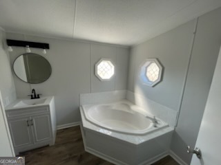306 Dennard Road Unadilla, GA 31091 - Photo 13 of 14 a bathroom with a sink and a mirror