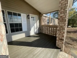 a view of a backyard of the house