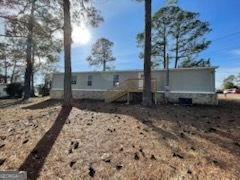 306 Dennard Road Unadilla, GA 31091 - Photo 3 of 14 a view of a backyard of the house