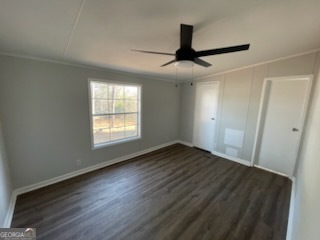 306 Dennard Road Unadilla, GA 31091 - Photo 9 of 14 a view of an empty room with wooden floor and a window