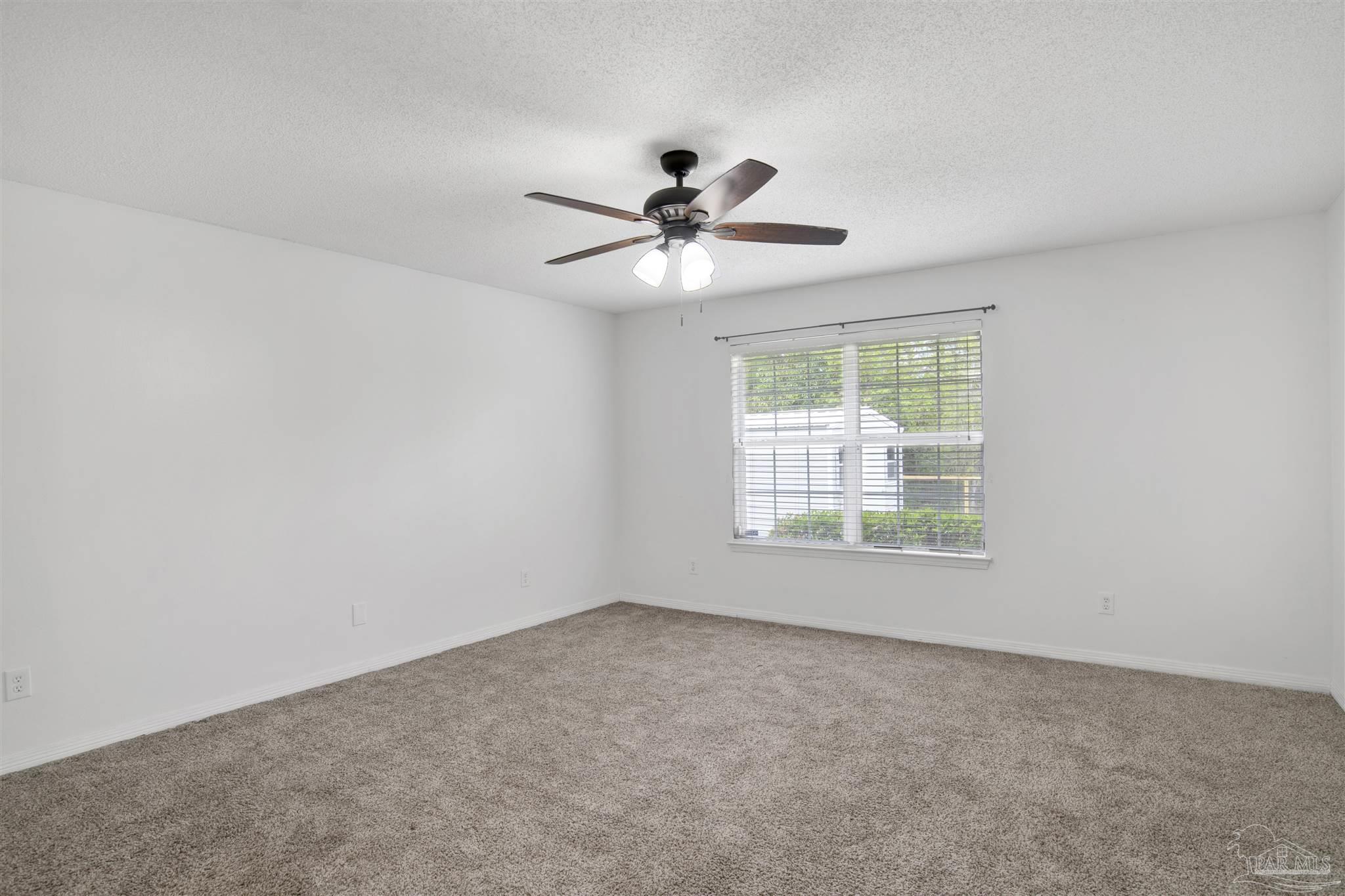 128 Gunwale Road Pensacola, FL 32507 - Photo 15 of 34 a view of a room with a window and a fan