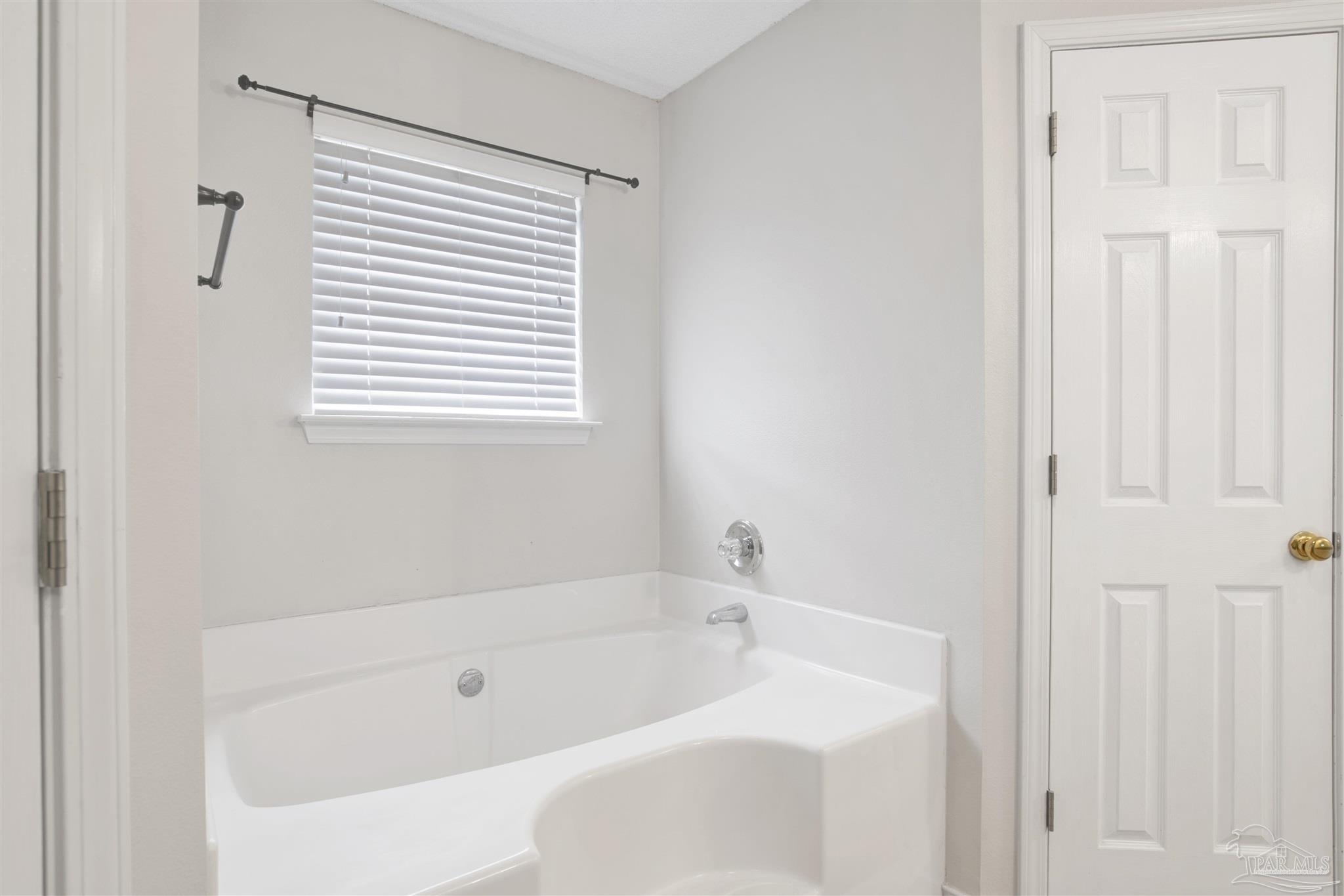 128 Gunwale Road Pensacola, FL 32507 - Photo 18 of 34 a white bath tub sitting next to a white sink