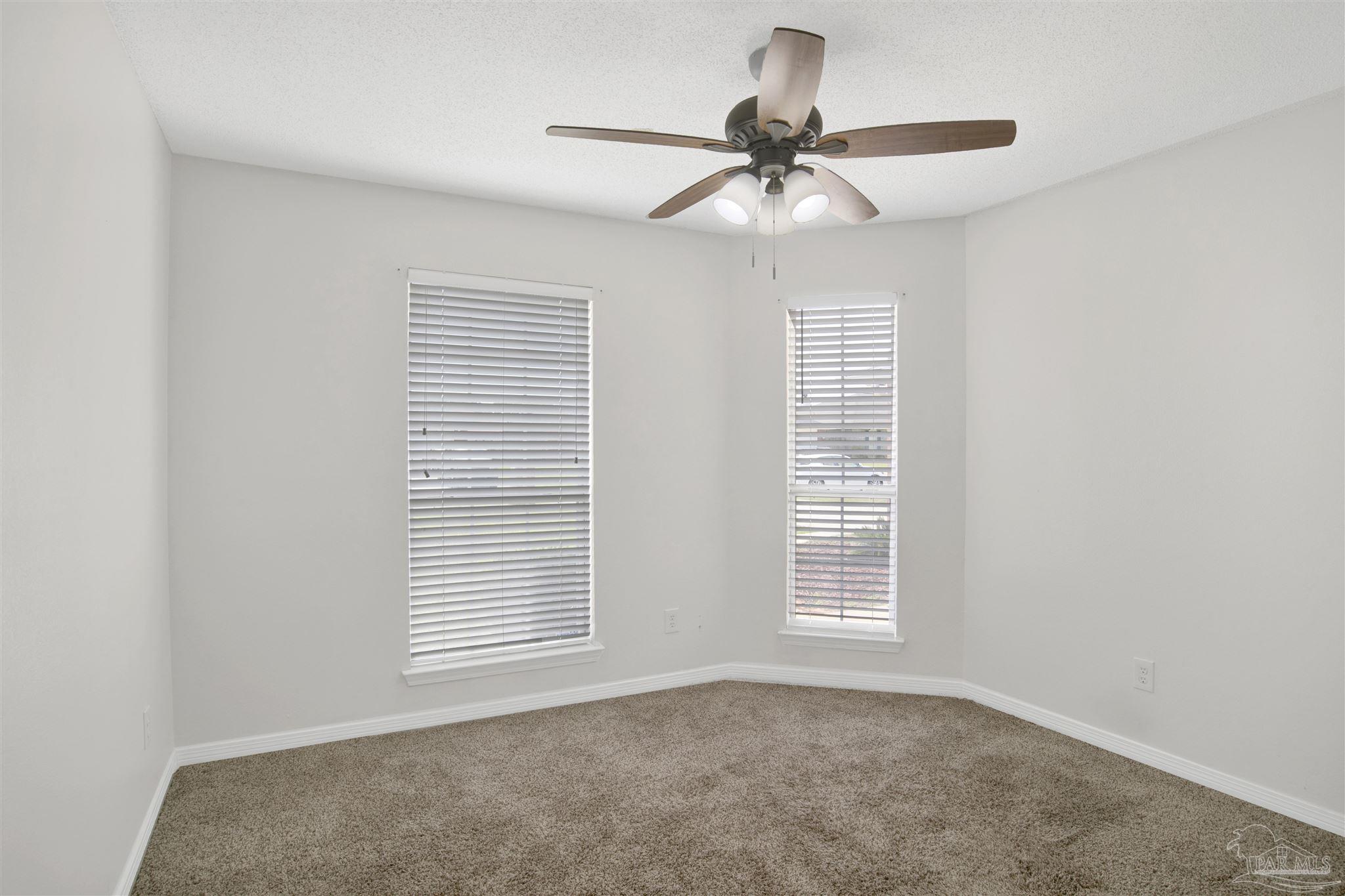 128 Gunwale Road Pensacola, FL 32507 - Photo 20 of 34 a view of an empty room with a window