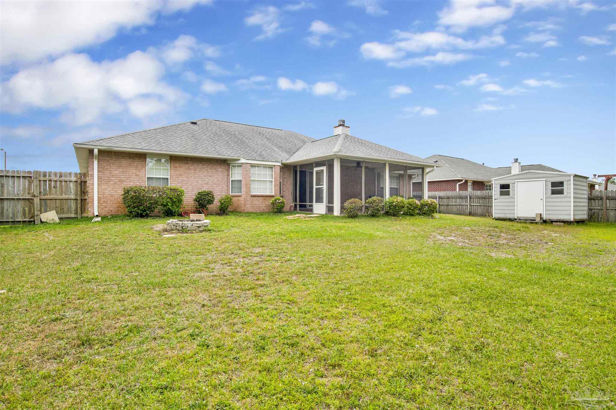 128 Gunwale Road Pensacola, FL 32507 - Photo 29 of 34 a view of a house with a yard