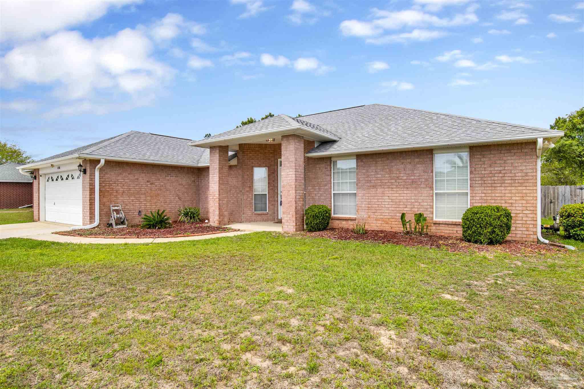 128 Gunwale Road Pensacola, FL 32507 - Photo 33 of 34 a front view of a house with garden