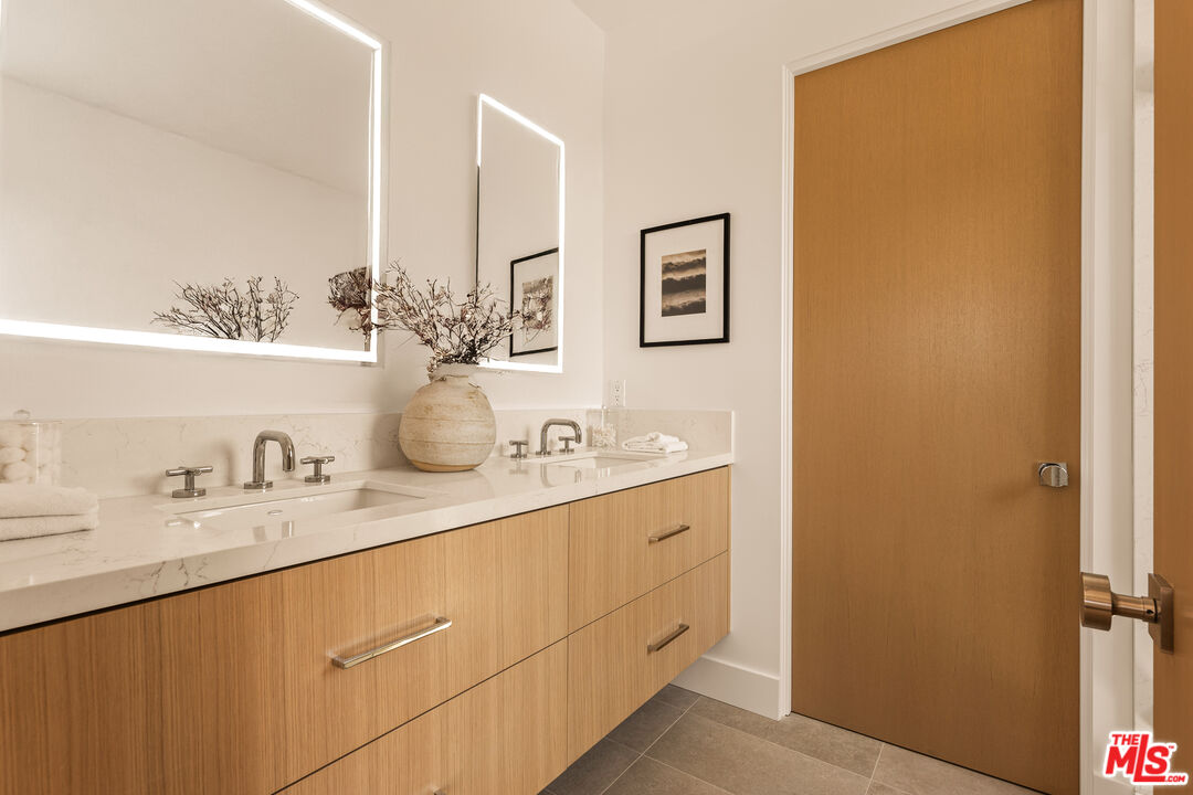 2425 20th Street, Unit B Santa Monica, CA 90405 - Photo 6 of 12 a bathroom with a sink and a mirror