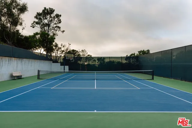 a view of a bench in front of house