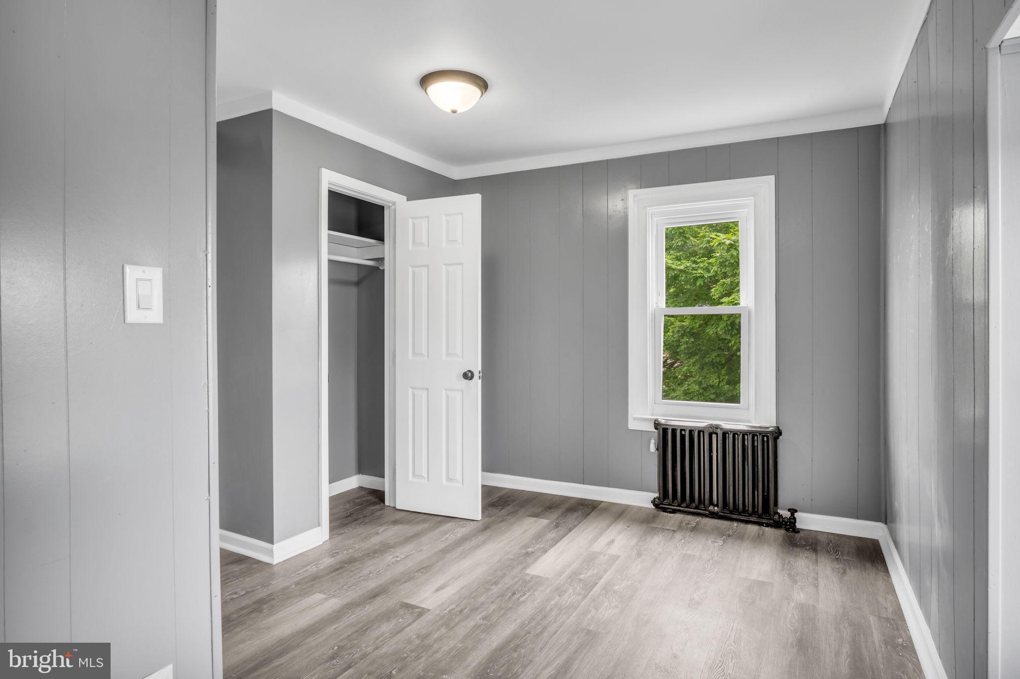 1426 Filbert Street, Unit 2 York, PA 17404 - Photo 14 of 17 an empty room with wooden floor and windows