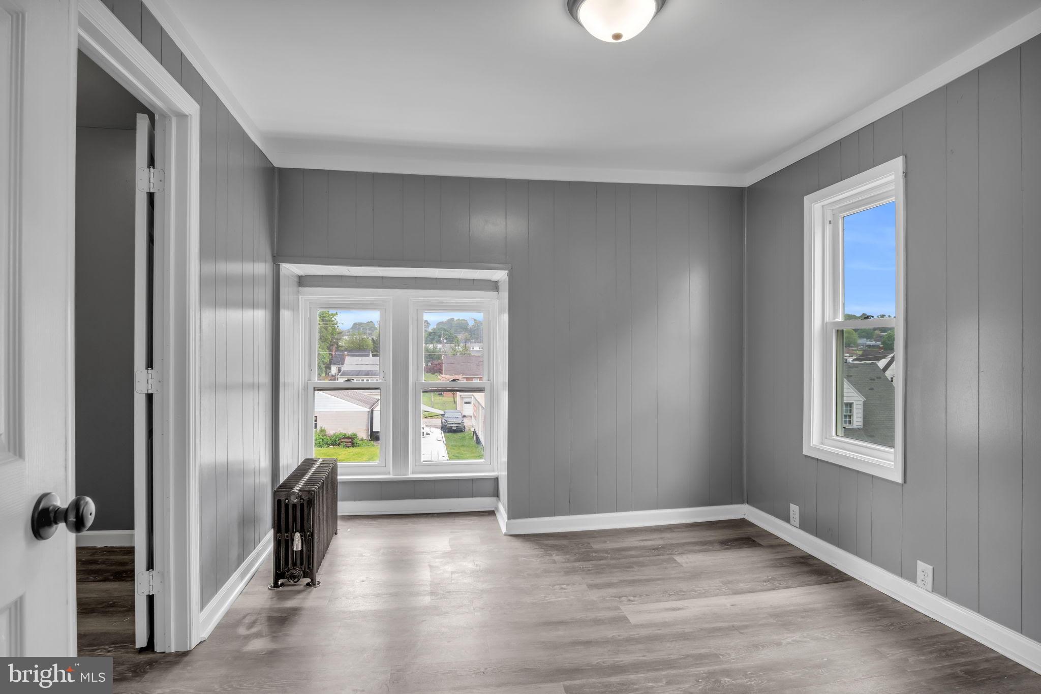 1426 Filbert Street, Unit 2 York, PA 17404 - Photo 16 of 17 wooden floor in an empty room with a window