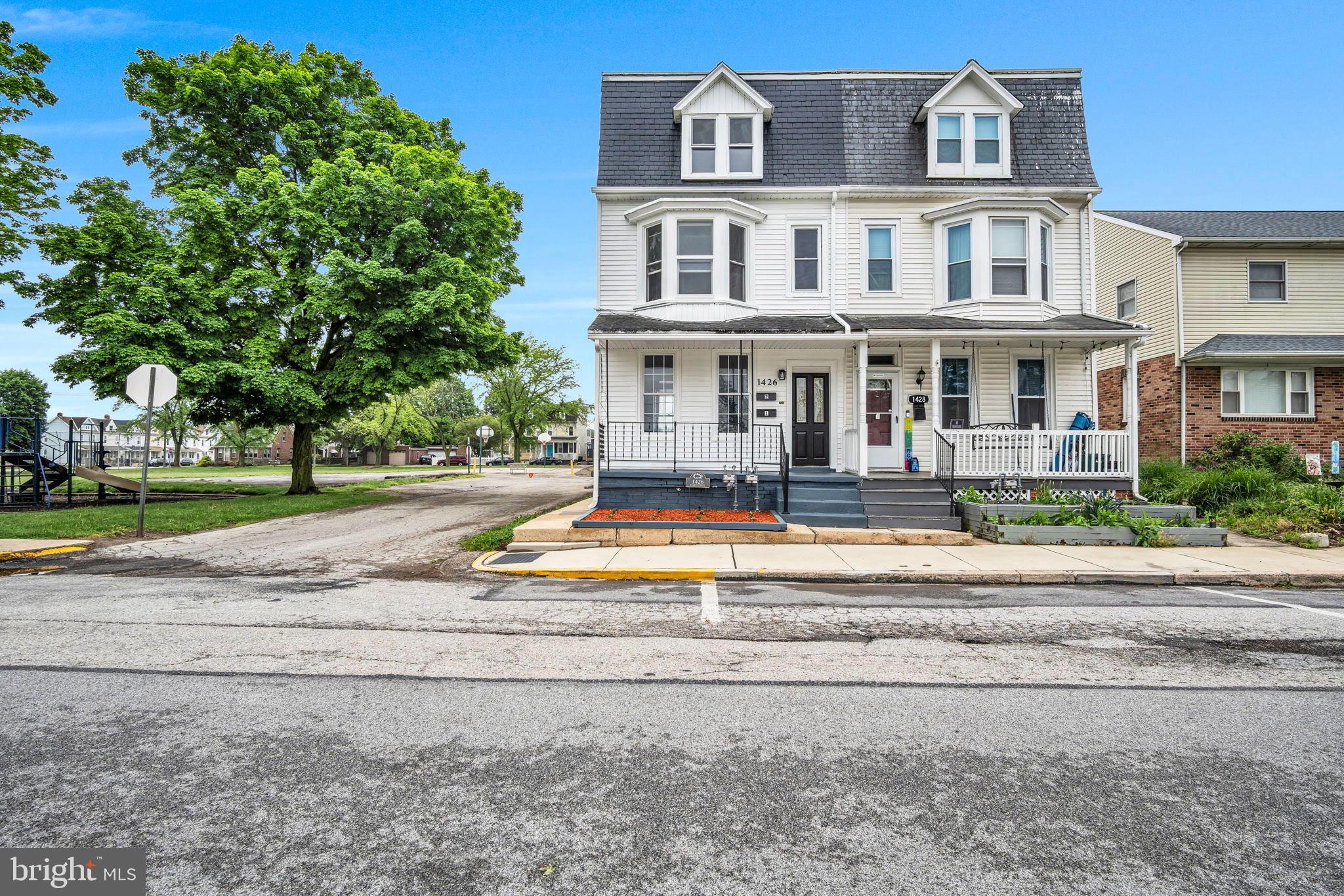 1426 Filbert Street, Unit 2 York, PA 17404 - Photo 2 of 17 a front view of house with yard and green space