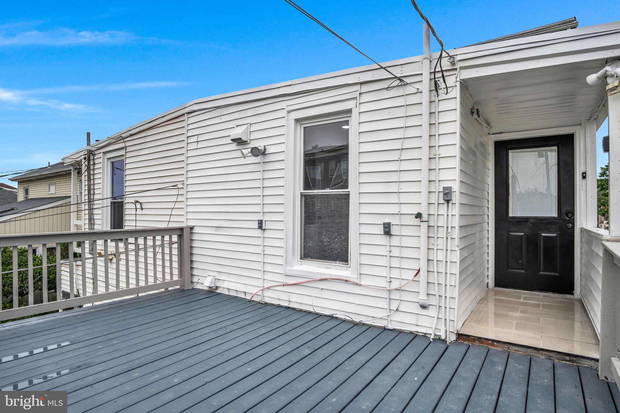 1426 Filbert Street, Unit 2 York, PA 17404 - Photo 4 of 17 a view of a balcony with wooden floor and fence