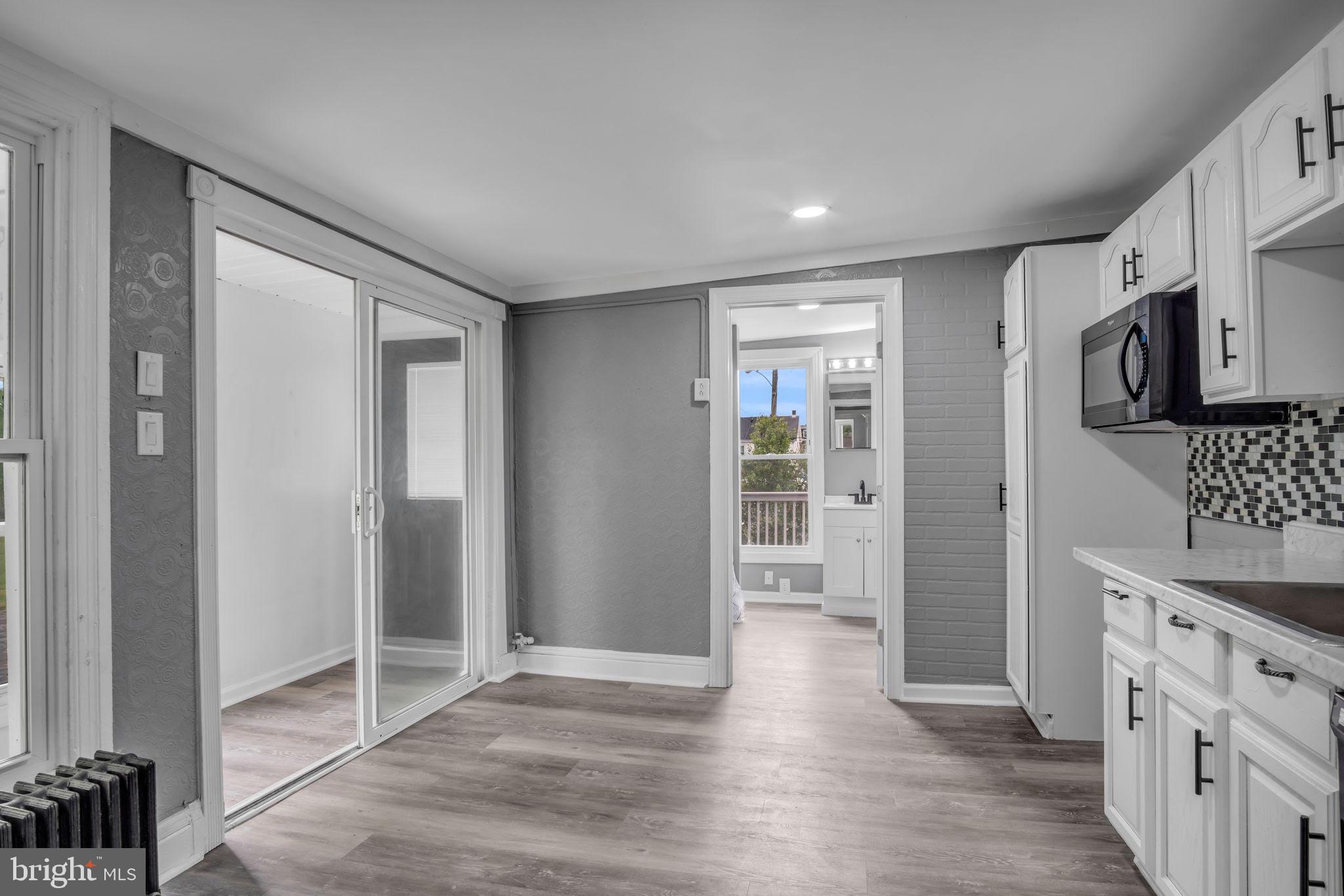 1426 Filbert Street, Unit 2 York, PA 17404 - Photo 8 of 17 a view of a kitchen with wooden floor and a sink
