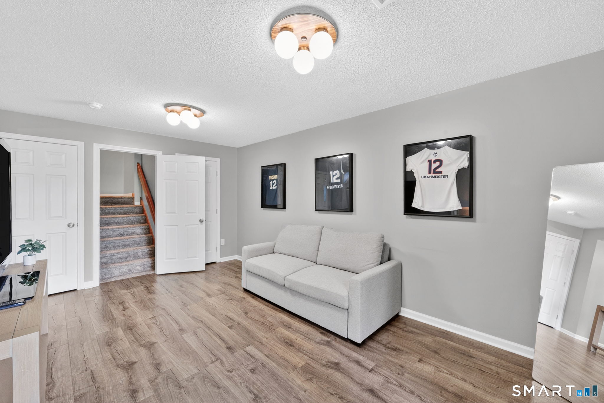 10 Depot Road, Unit 22 Willington, CT 06279 - Photo 21 of 36 a living room with furniture and a flat screen tv
