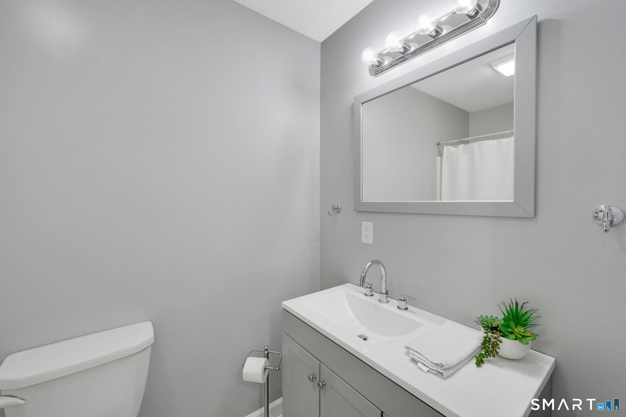 10 Depot Road, Unit 22 Willington, CT 06279 - Photo 26 of 36 a bathroom with a sink vanity and toilet