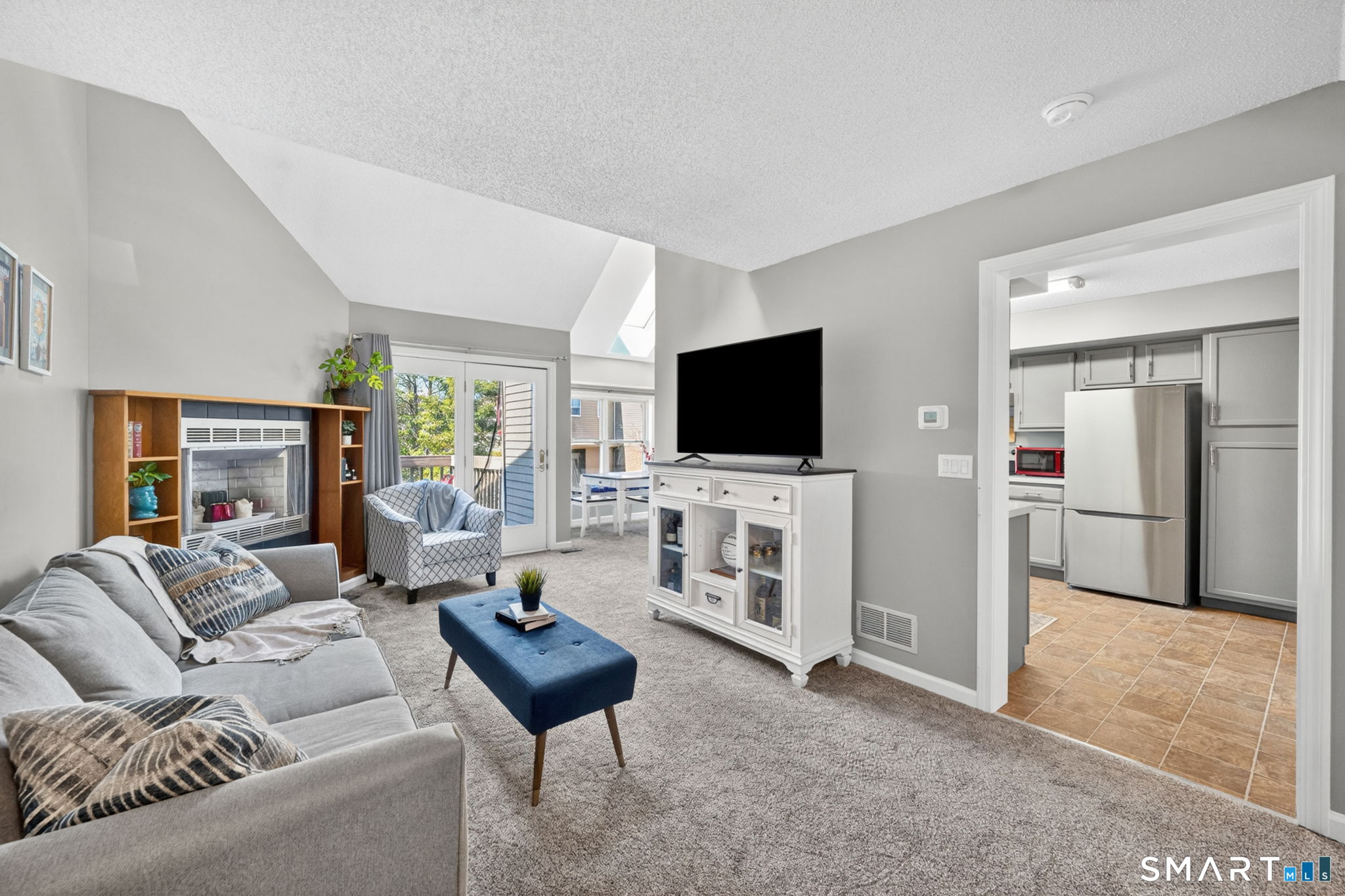 10 Depot Road, Unit 22 Willington, CT 06279 - Photo 3 of 36 a living room with furniture and a flat screen tv