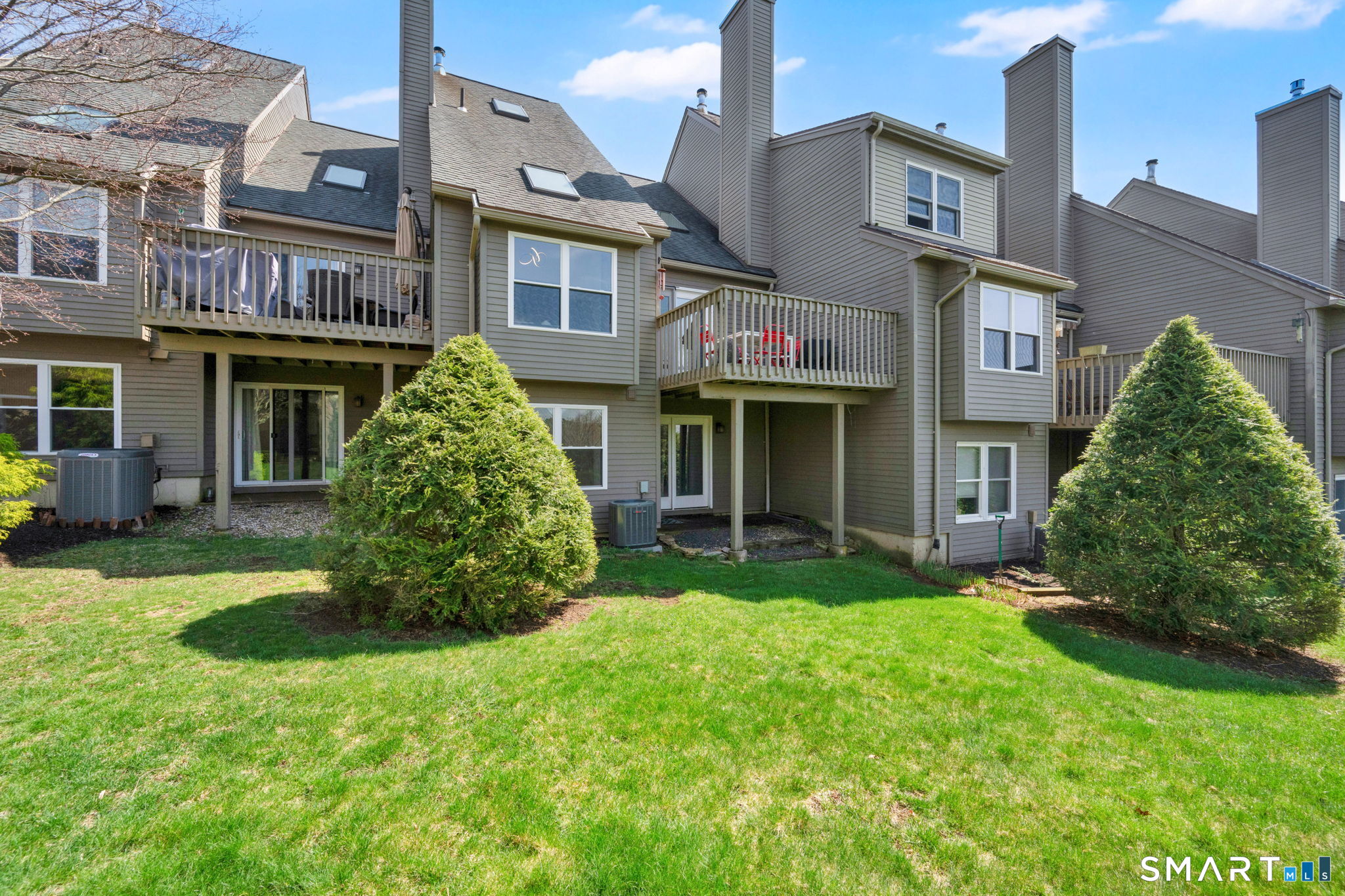 10 Depot Road, Unit 22 Willington, CT 06279 - Photo 31 of 36 a view of a brick house with a yard and plants
