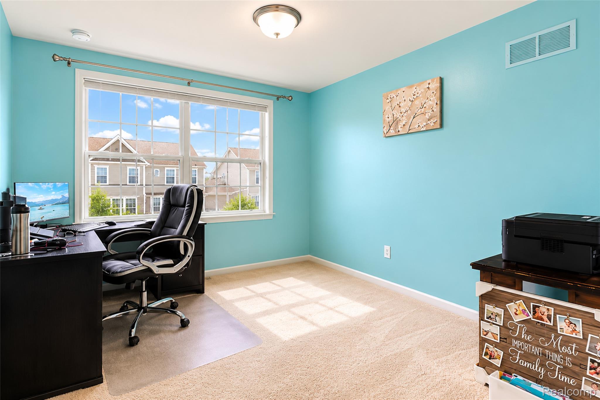 50873 Scarborough Road Canton, MI 48188 - Photo 20 of 33 Bright room featuring a large window with white framing, light-colored carpeting, a ceiling-mounted light fixture, and light blue wall finishes