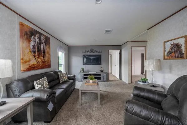 a living room with furniture and a couch