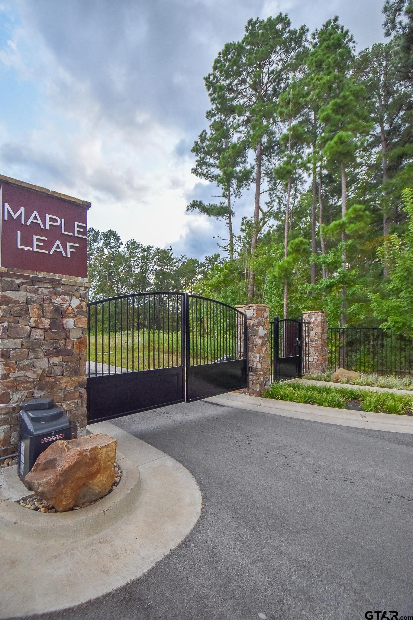 7933 Maple Lane Tyler, TX 75703 - Photo 9 of 10 a backyard of a house with a garden and barbeque oven
