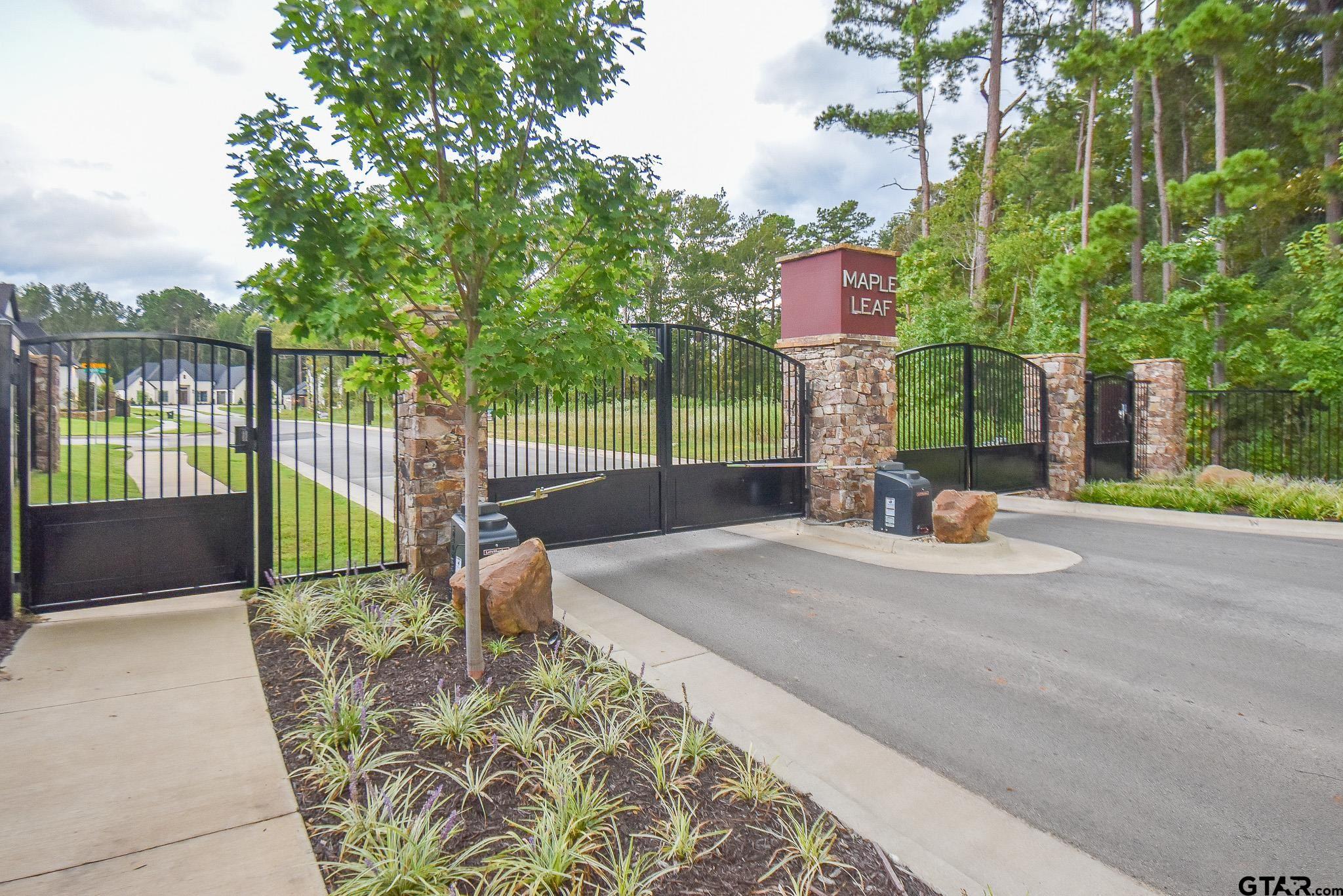 7933 Maple Lane Tyler, TX 75703 - Photo 10 of 10 a view of a park with iron fence