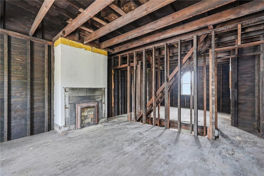 5405 Kent Way Pittsburgh, PA 15201 - Photo 9 of 24 a view of an empty room with wooden floor and a fireplace